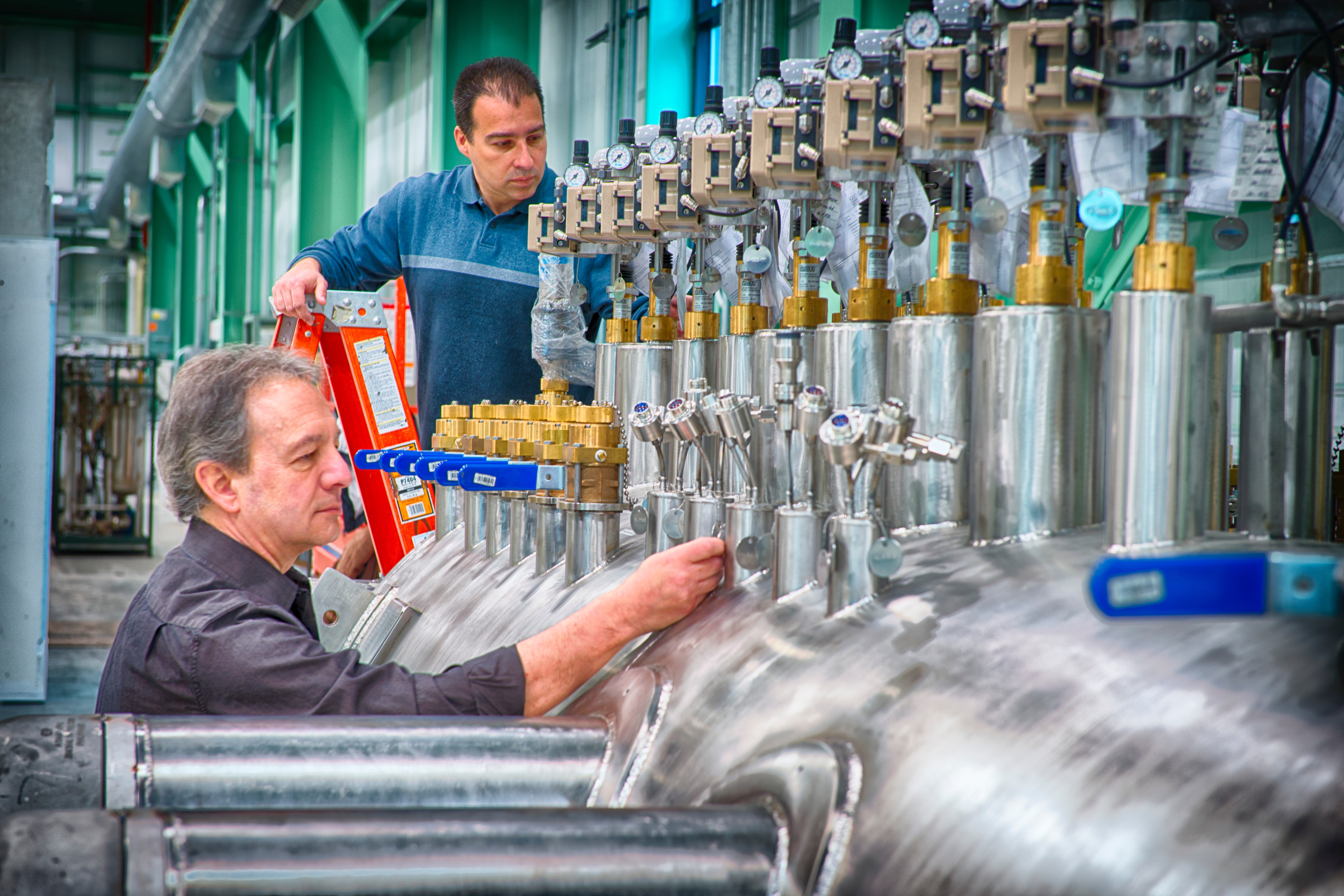 workers checking tanks